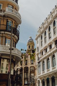 Kaboompics - Vertical Upward View of Madrid’s Historic Facades and Bell Tower Between Buildings