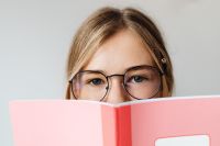 Kaboompics - Young Schoolgirl with Corrective Glasses and Notebook