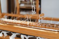 Kaboompics - White Warp Threads Stretched Across a Loom