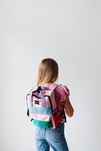 Kaboompics - Schoolgirl Wearing Colorful Backpack from Behind