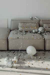 Kaboompics - Wide Gray Couch New Year's Eve Party Scene with Disco Balls and Copy Space