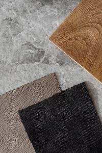 Kaboompics - Black Bouclé Upholstery Fabric Swatch and Wood Grain Sample