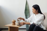 Kaboompics - Woman Drinking Coffee in a Light Minimal Interior