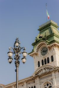 Kaboompics - Trieste Clock Tower and Ornate Street Lamp Against Clear Sky