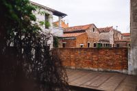 Kaboompics - Aged Brick Courtyard and Terracotta Roofs in a Quiet Murano Backstreet