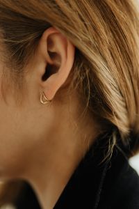 Kaboompics - Close-Up Gold Hoop Earring and Blonde Hair