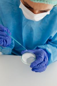 Kaboompics - Gloved Scientist Handling a Petri Dish Culture