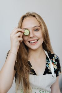 Kaboompics - Playful Home Cook with a Cucumber Slice over One Eye