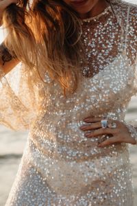 Kaboompics - Sequin Dress and Statement Rings Beach Fashion Close Up