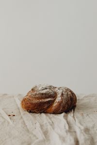 Kaboompics - Rustic Sourdough Loaf on Wrinkled Linen