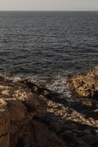 Kaboompics - Rocky Coastline Beside Calm Open Sea