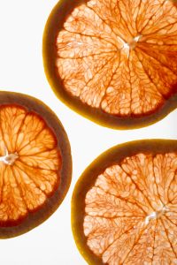 Kaboompics - Grapefruit Slices on White Background
