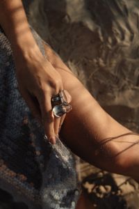 Kaboompics - Statement Rings and Sequin Skirt Fashion Detail