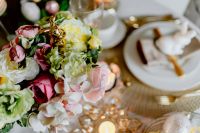 Kaboompics - Pink and White Spring Flower Bouquet beside a Gold Easter Place Setting and Candle