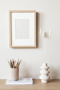 Kaboompics - Vertical Frame Mockup with Pampas Grass, Pencils and Candle for Home Decor