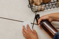 Kaboompics - Close-Up of Hand Cleaning Floor Tiles with Spray