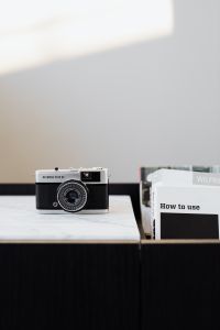 Kaboompics - Vintage Olympus Trip 35 on Marble with Neutral Copy Space for Photography and Travel Design