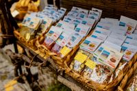 Kaboompics - Italian Market Stall With Packaged Spices And Dried Vegetables