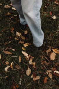 Kaboompics - Jeans and Black Boots Among Fallen Autumn Leaves
