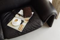 Kaboompics - Woven Bag, Sunglasses, Cup and Magazine on a Leather Sofa