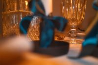 Kaboompics - Teal Satin Bow and Crystal Glassware in Soft Focus