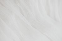 Kaboompics - Cloud Dancer White Fabric Texture with Soft Folds