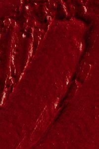 Kaboompics - Deep Red Lipstick Texture with Rich Shimmer