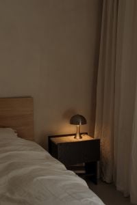 Kaboompics - Minimal Bedroom Corner with Bedside Lamp, Sheer Curtain and Wall Copy Space