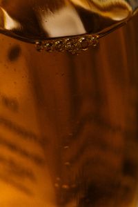 Kaboompics - Amber Liquid Surface with Bubbles