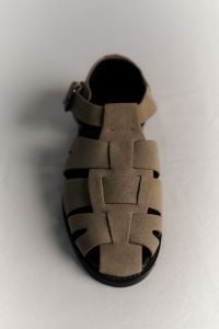 Kaboompics - Single Beige Woven Sandal in Minimal Product Layout