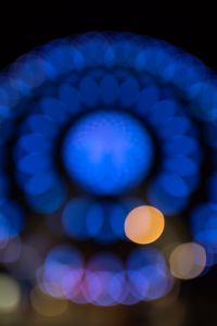 Kaboompics - Blue Ferris Wheel Light Orbs Forming a Circular Bokeh Pattern