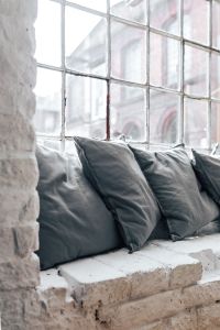 Collection of grey and white pillows