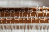 Kaboompics - Woven Textile and White Fringe on a Loom