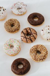 Kaboompics - Various donuts on white marble