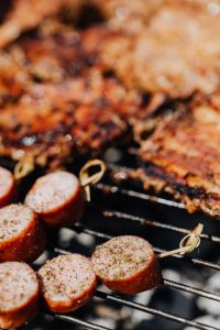 Kaboompics - Soft-Focus Barbecue Background with Grilled Pork and Sausage Skewers in the Foreground