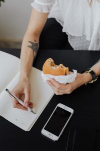 Kaboompics - Professional Woman Combining Note-Taking and Lunch