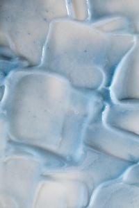 Kaboompics - Pale Blue Skincare Cream Swatches with Soft Ridges, Macro Texture