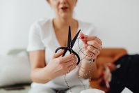Kaboompics - Cutting Natural Twine with Scissors for Hand-Wrapped Parcel Packaging