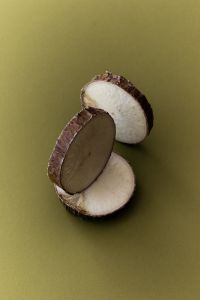 Kaboompics - Coconut Slices on Olive Green Background