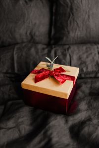 Kaboompics - Christmas Gift Boxes Beside a Red Joy Pillow