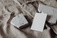 Kaboompics - Wide Blank Business Card between Two Textured Marble Pieces