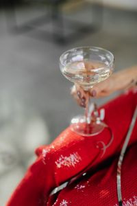 Kaboompics - Close-Up Champagne Toast over Sparkling Red Pants