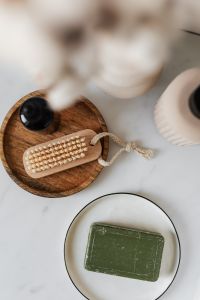 Kaboompics - Overhead Bathroom Still Life with Green Soap, Wooden Tray and Soft Cotton-Stem Details