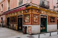 Kaboompics - Ornate Spanish Restaurant Facade with Colorful Tilework and Menu Displays