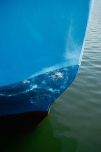 Kaboompics - Blue Boat Hull With Mooring Rope and Water Reflection