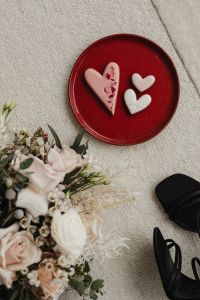 Kaboompics - Heart Shaped Cookies on a Red Plate with a Blush Bouquet