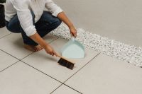Kaboompics - Woman Mopping a Tiled Floor in a Living Room
