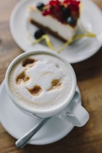 Cup of coffee and berry cheesecake