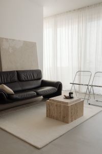 Black Leather Sofa and Chrome Folding Chairs