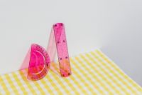 Kaboompics - Pink Ruler and Protractor Still Life on Yellow Gingham